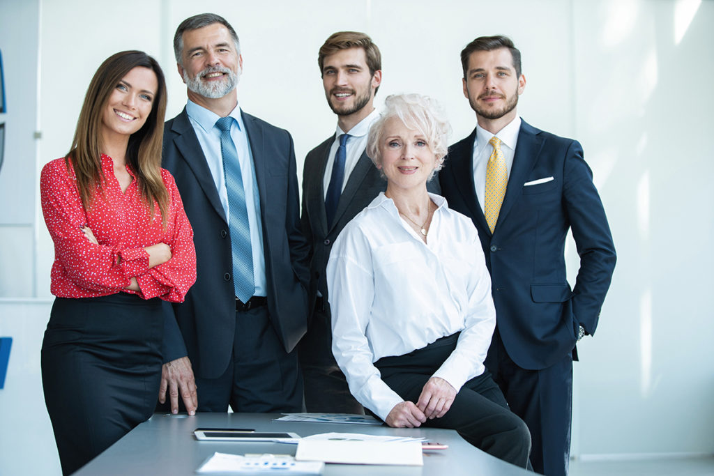 group of businesspeople standing together in office.